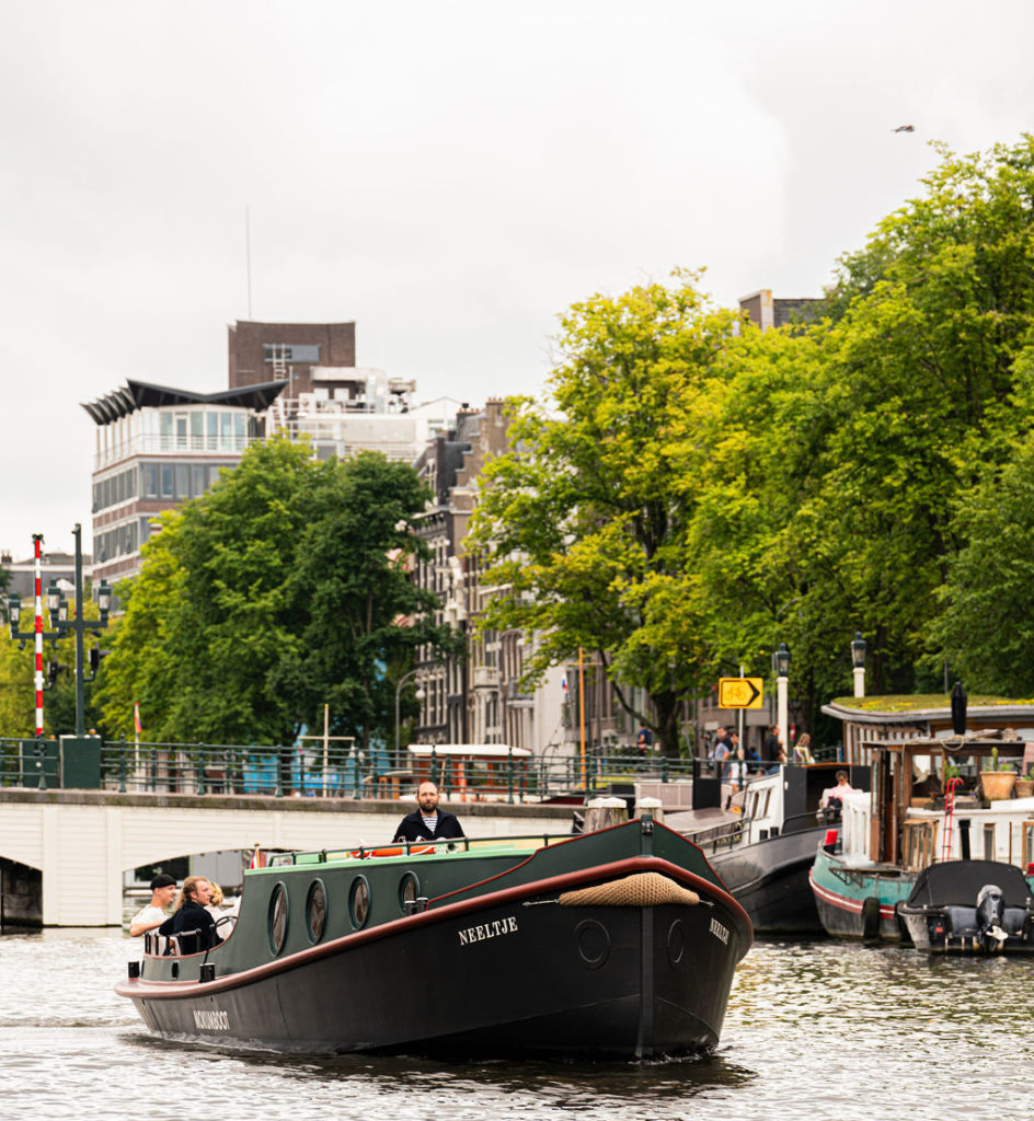 Tugboat sailing on Amsterdam's canals